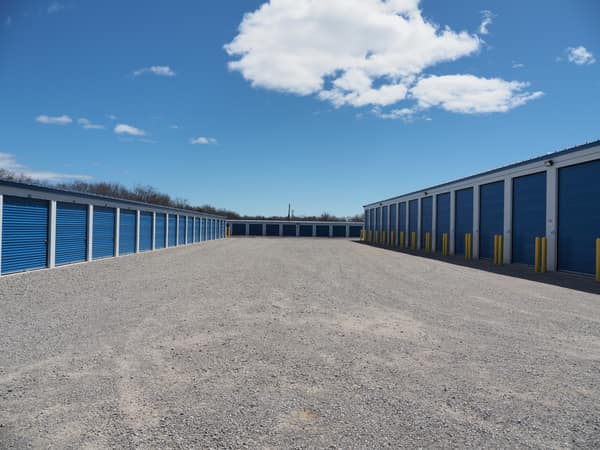 Paved drive lanes between storage buildings