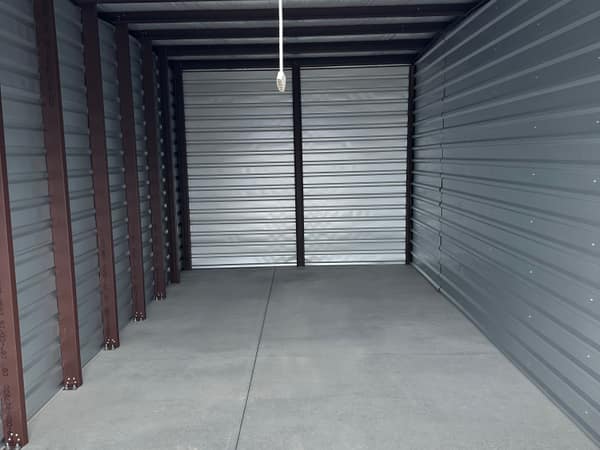 Inside a clean, empty 10x20 drive-up unit with an 8-foot ceiling