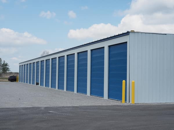Wide view of the tall-unit building and paved drive